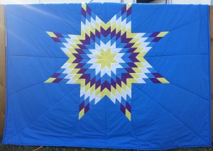 49. Blue Blanket with Yellow, White, Blue and Purple Star.