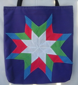 6. Purple bag with blue, light green, dark pink and white star.