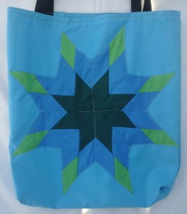 12. Blue bag with dark green, light green and blue star.