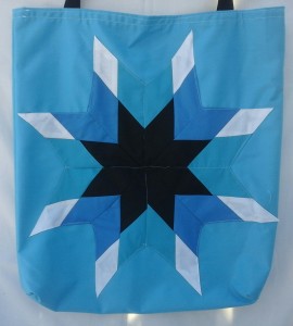 11. Blue bag with black, dark blue, light blue and white.