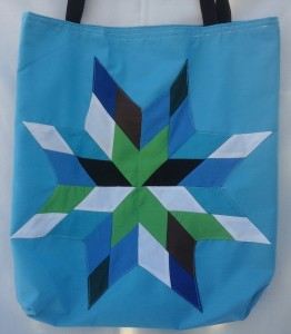 6. Blue bag with a multicolor design.