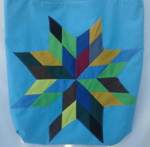 3. Blue bag with rainbow color design.