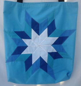 2. Blue bag with light and dark blue and white star.