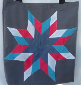 8. Grey bag with light blue, white, pink and grey star