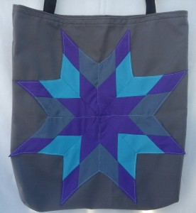 6. Grey bag with light blue, purple and grey star