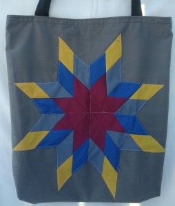 5. Grey bag with burgundy, grey, blue and gold star