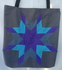 4. Grey bag with purple, light blue and grey star