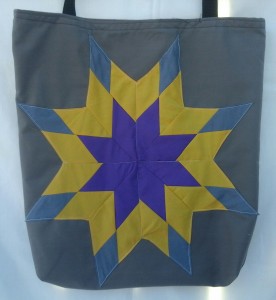 3. Grey bag with purple, gold and grey star