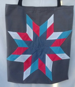 2. Grey bag with hot pink, blue and grey, and white star