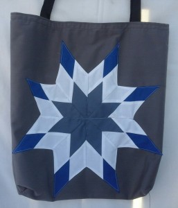 1. Grey bag with blue, grey and white star