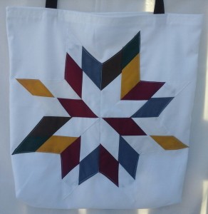 4. White bag with burgundy, white, grey, gold, and, green .