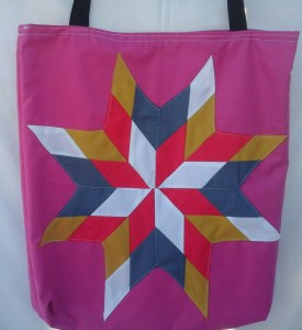 5. Pink bag with grey, white, red, and gold star