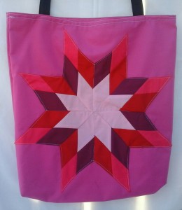 3. Pink bag with red, pink, burgundy, and dark pink bag