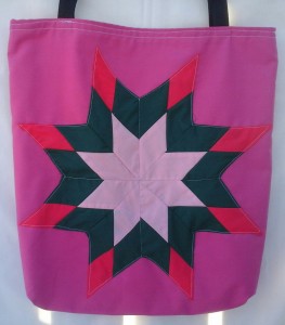 1. Pink bag with pink , green and red star