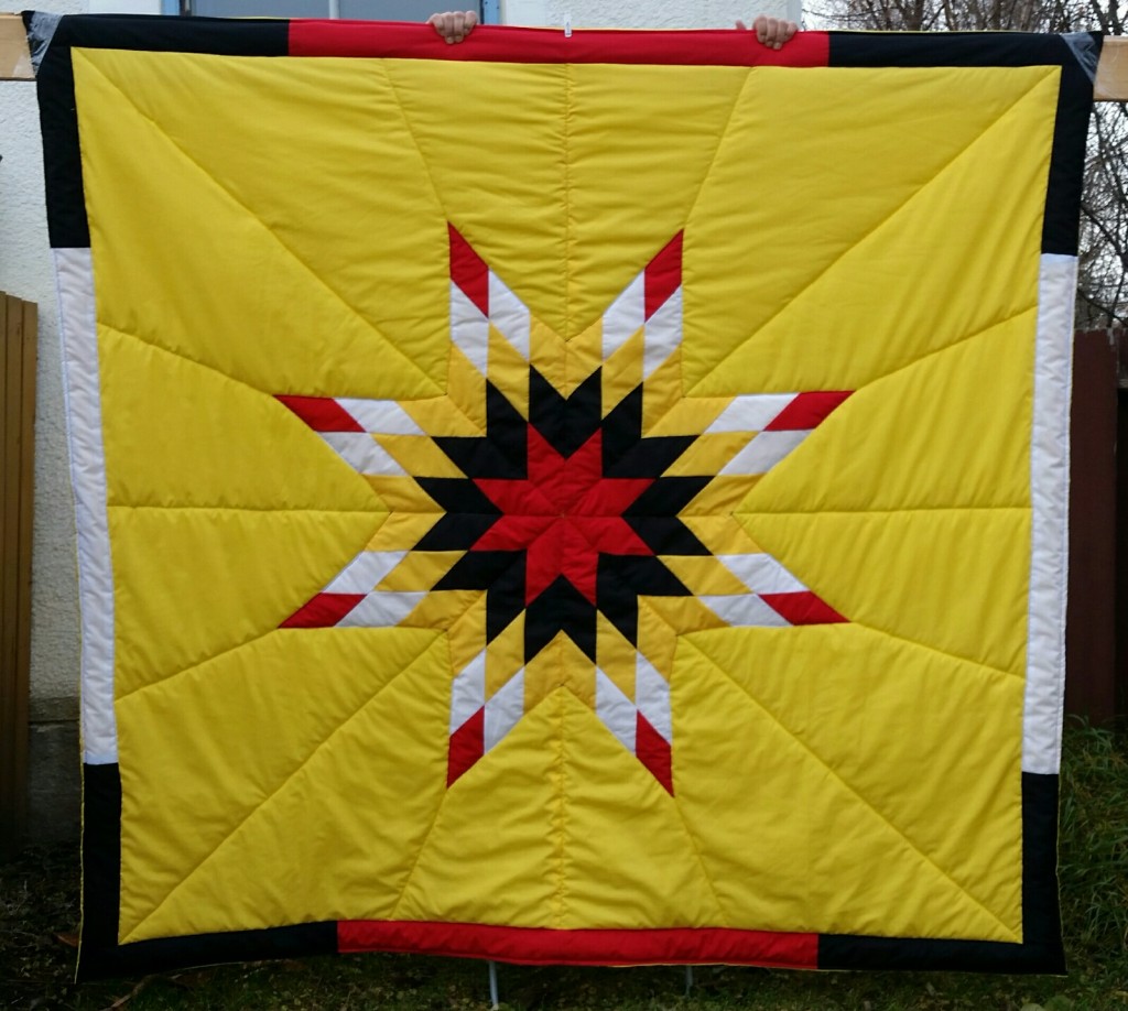 Yellow Star Blanket with 4 colors in the Star