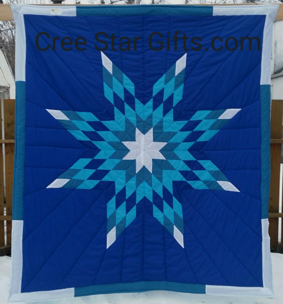 Royal Blue star blanket with white, ocean blue, turquoise and royal blue star. The border white and ocean blue.