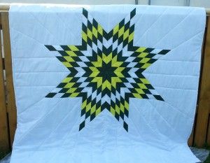 33. White Blanket with Green, Yellow and White Star