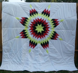 White Star Blanket with yellow, black, red, and white star.