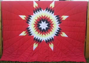 Red Blanket with White, Black, Yellow and Red Star.