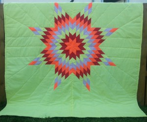 Yellow Blanket with Orange, Red, Yellow, and Grey Star.