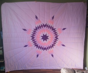 Light Purple Blanket with dark purple & light purple, and pink star.