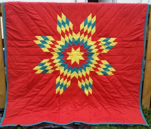 Red Blanket with Yellow, Turquoise, and Red Star