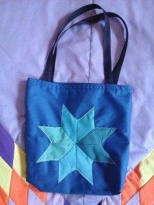 Blue Seminar bag, with four different shades of blue in the star.