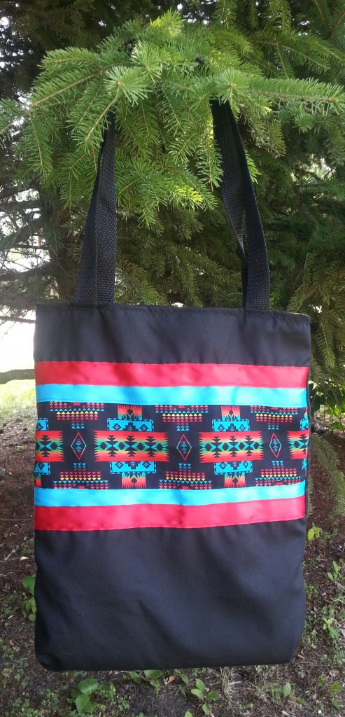 Black Bag with Red/Blue Ribbon and Print.