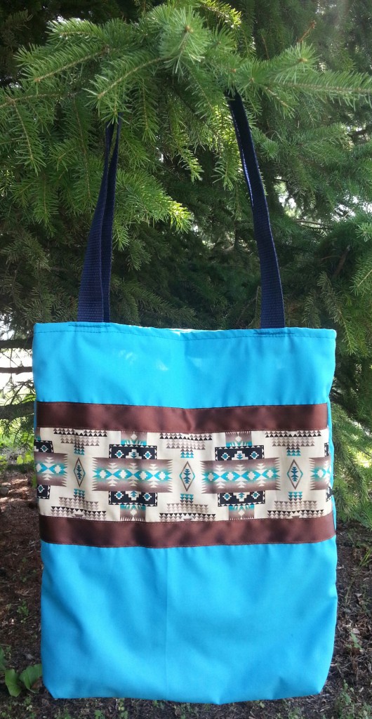 Blue Bag with Brown Ribbon and Print.