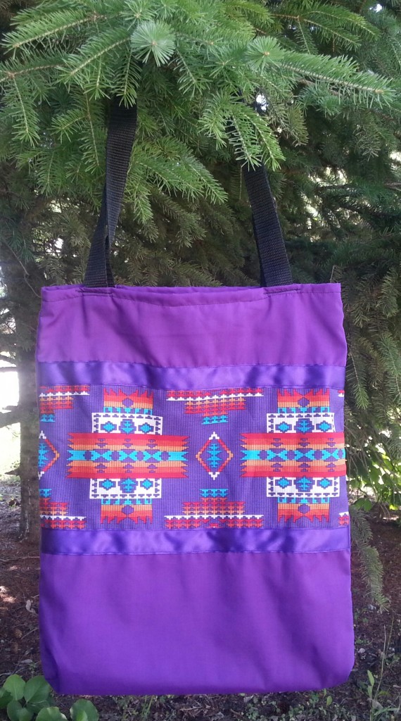 20. Purple bag with print and purple ribbon.