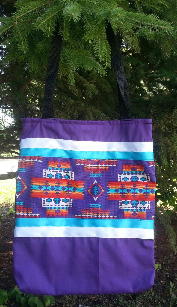 18. Purple bag with print and white and blue ribbon