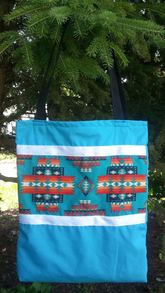 Blue bag with print and white ribbon