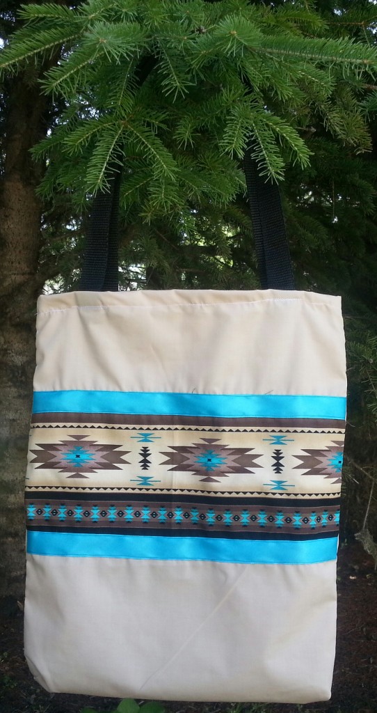 Tan bag with print and blue ribbon