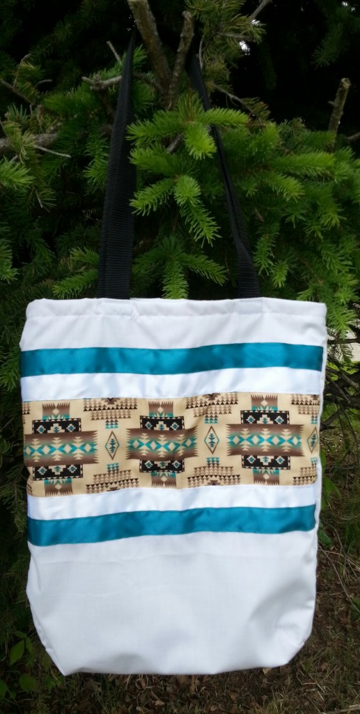 6. White bag with Navajo print and red/blue ribbon