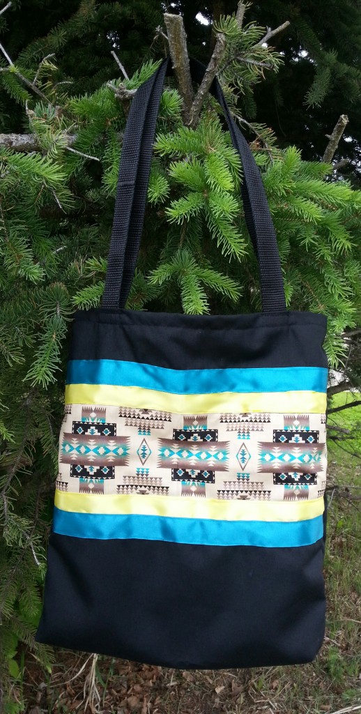 4. Black bag with Navajo print and yellow/blue ribbon
