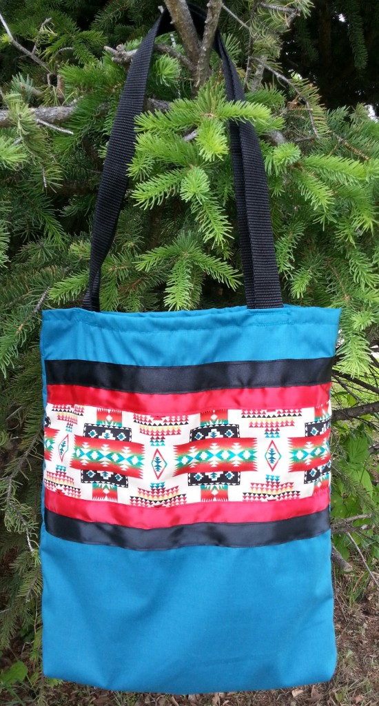 2. Blue/turquoise bag with Navajo print and red/black ribbon