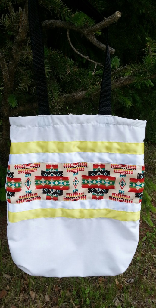 7. White bag with Navajo print and white/yellow ribbon